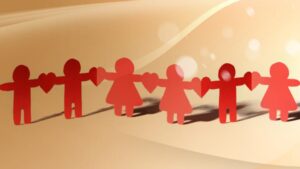 origami de hombre y mujer unidos por corazones